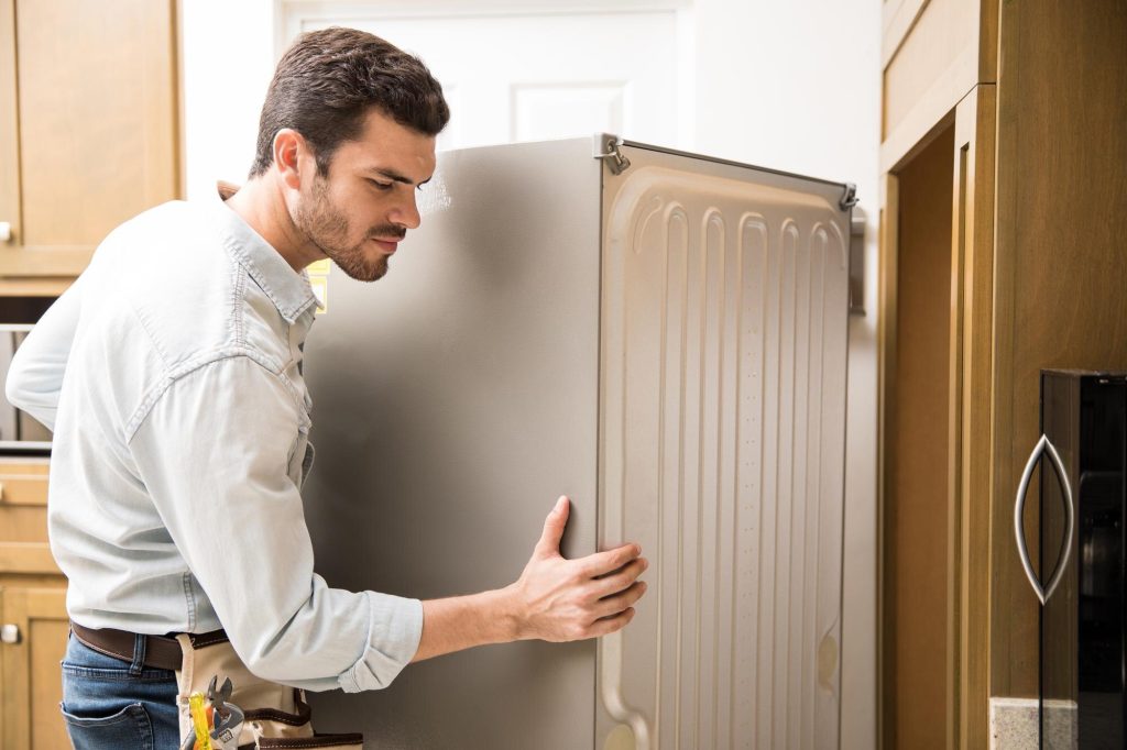 Young Man Working As Electrician Exposing Back Fridge Check Repair It 662251 2712 1024x682